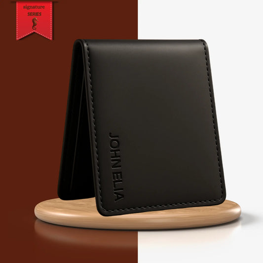 Black leather wallet with 'JOHN ELIA' branding on a wooden stand against a gradient background.