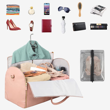 Open pink travel bag with various travel items displayed around it on a white background.